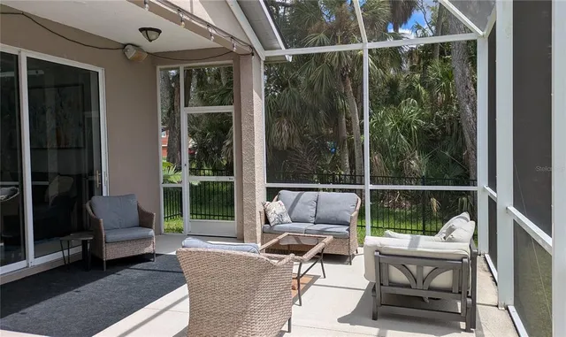 a balcony with furniture and a gate