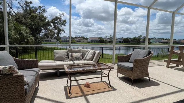 a roof deck with couches and potted plants