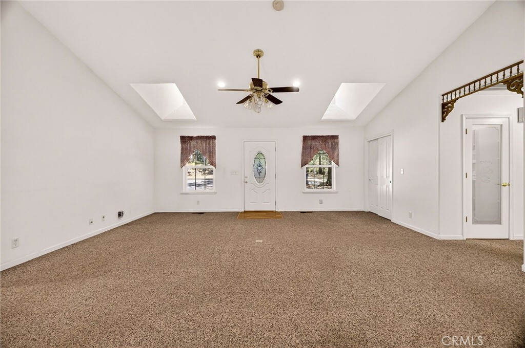 10202 Cohasset Road Chico, CA 95973 - Photo 14 of 75 an empty room with windows and fan