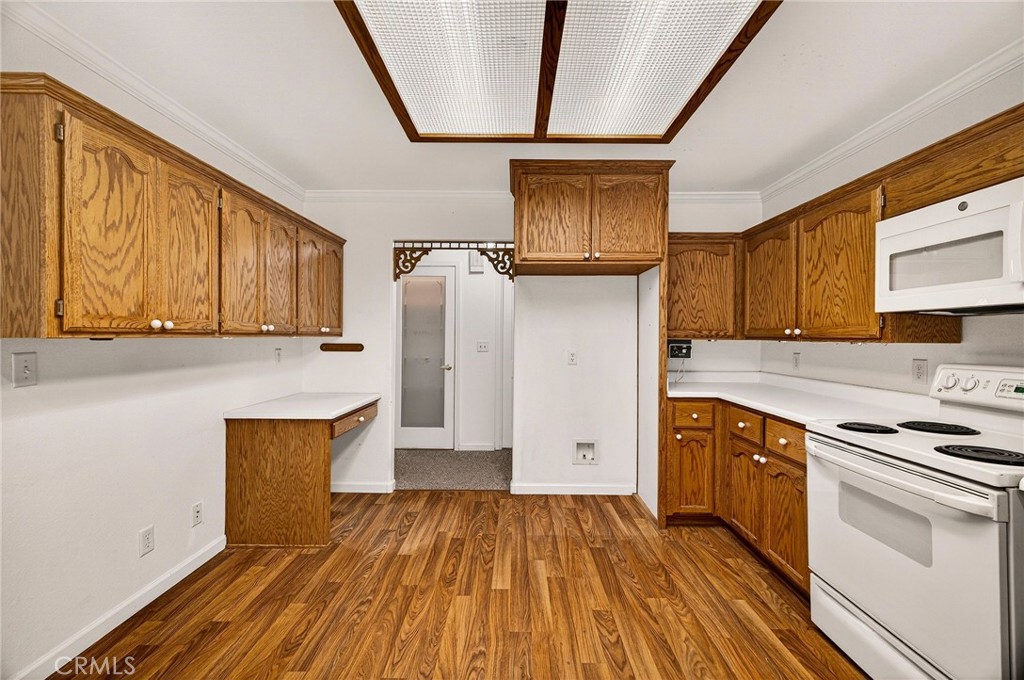 10202 Cohasset Road Chico, CA 95973 - Photo 21 of 75 a kitchen with stainless steel appliances a refrigerator and a stove top oven