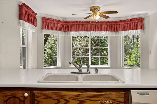 a bathroom with a double vanity sink mirror and bathtub