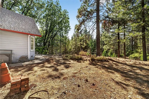 a view of a house with a tree