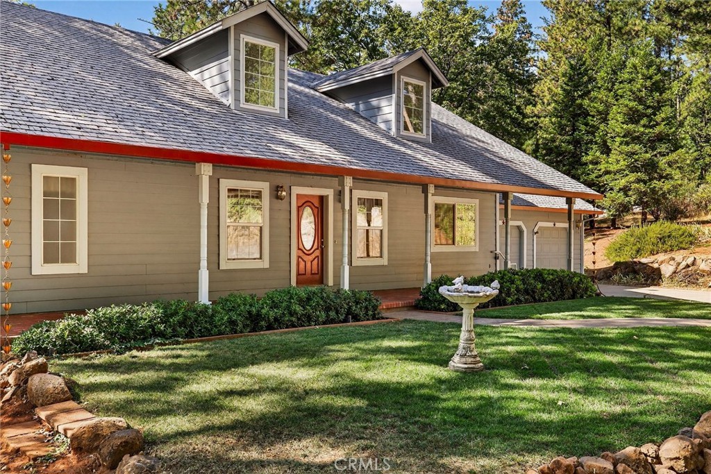 10202 Cohasset Road Chico, CA 95973 - Photo 7 of 75 a front view of a house with garden and trees
