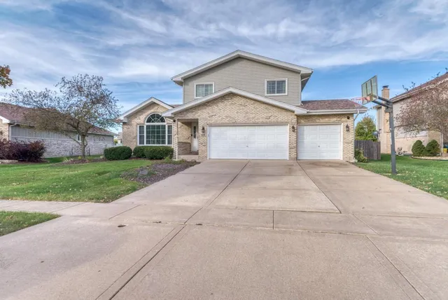 a front view of a house with yard