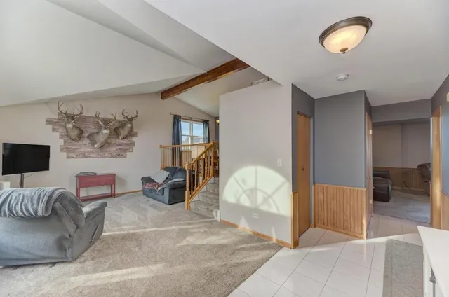 a view of a livingroom with furniture and cabinet