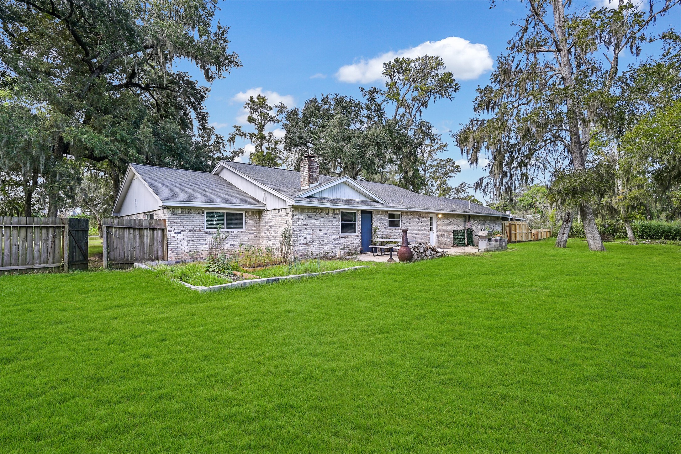 209 Buffalo Trail Lake Jackson, TX 77566 - Photo 30 of 34 a front view of house with yard and green space