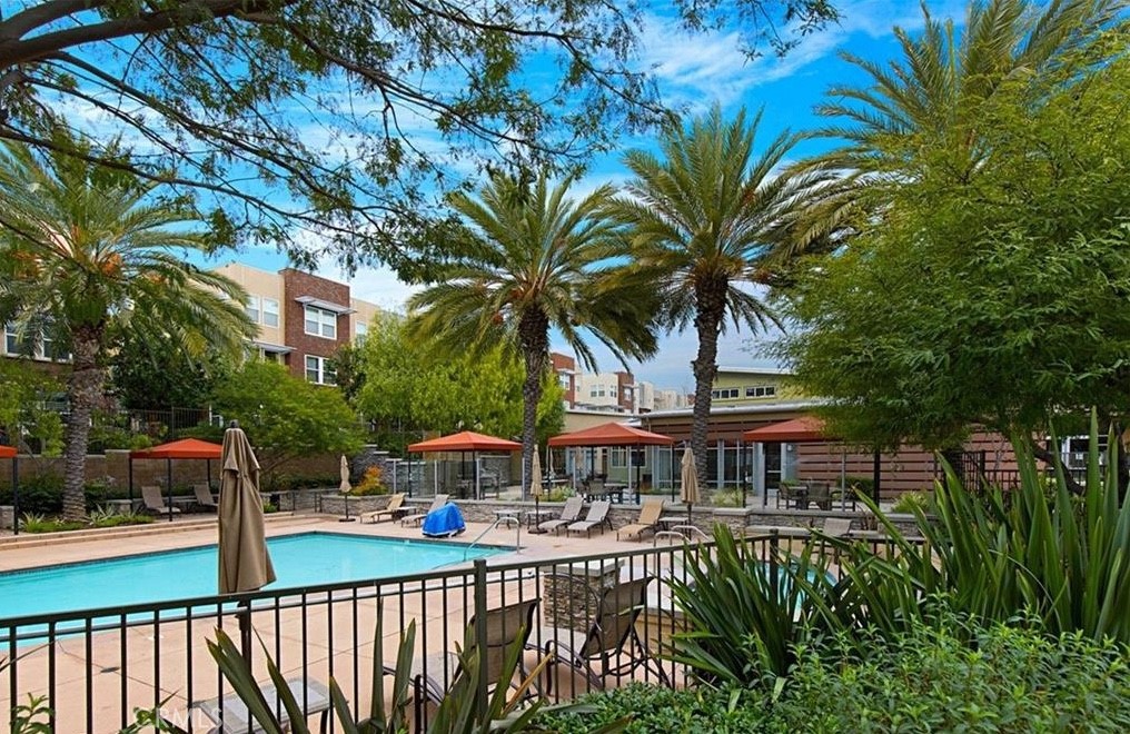 24 Colonial Way Aliso Viejo, CA 92656 - Photo 15 of 27 a balcony with table and chairs and potted plants