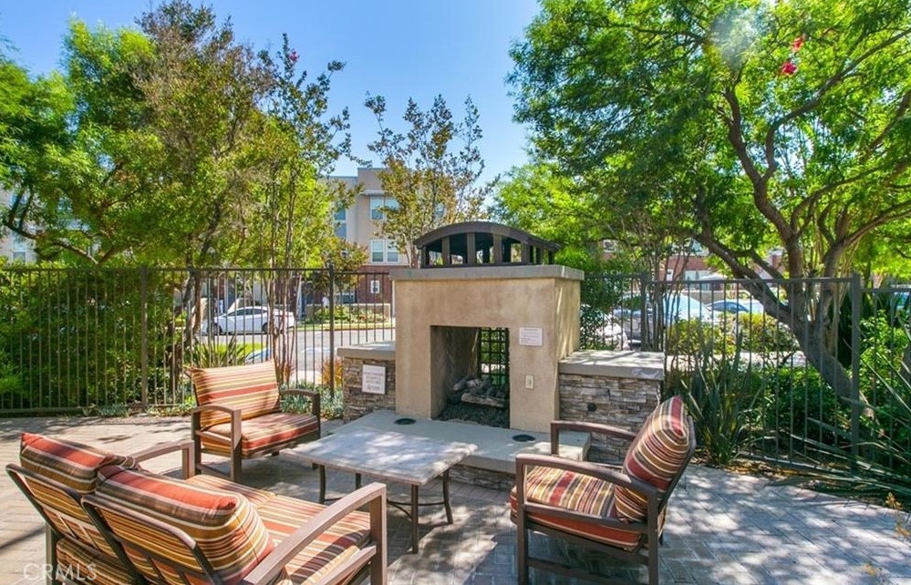 24 Colonial Way Aliso Viejo, CA 92656 - Photo 22 of 27 a backyard of a house with table and chairs
