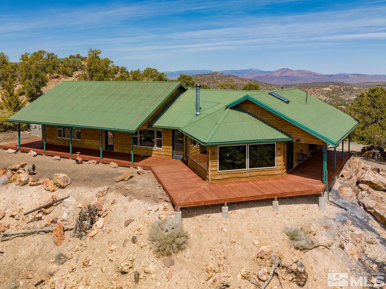 700 Saddleback Road Reno, NV 89521 - Photo 1 of 38 an aerial view of a house with a yard