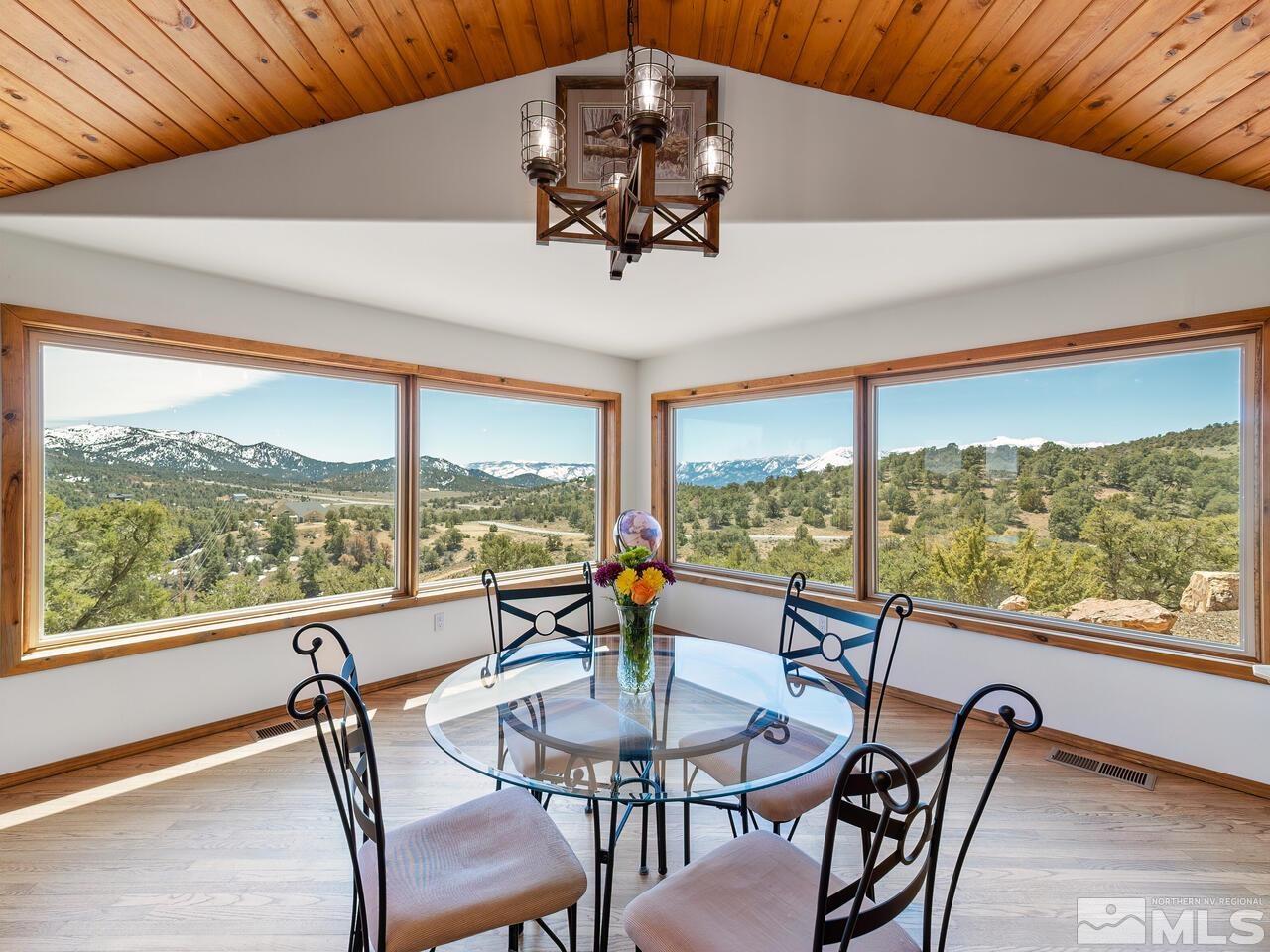 700 Saddleback Road Reno, NV 89521 - Photo 14 of 38 a view of a dining room with furniture window and outside view