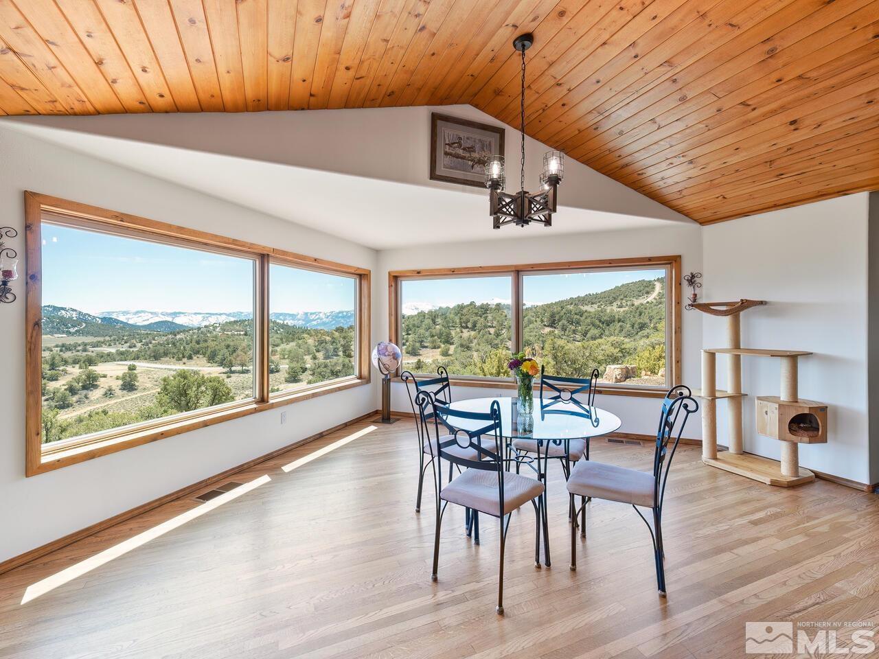 700 Saddleback Road Reno, NV 89521 - Photo 15 of 38 a dining room with furniture window and wooden floor