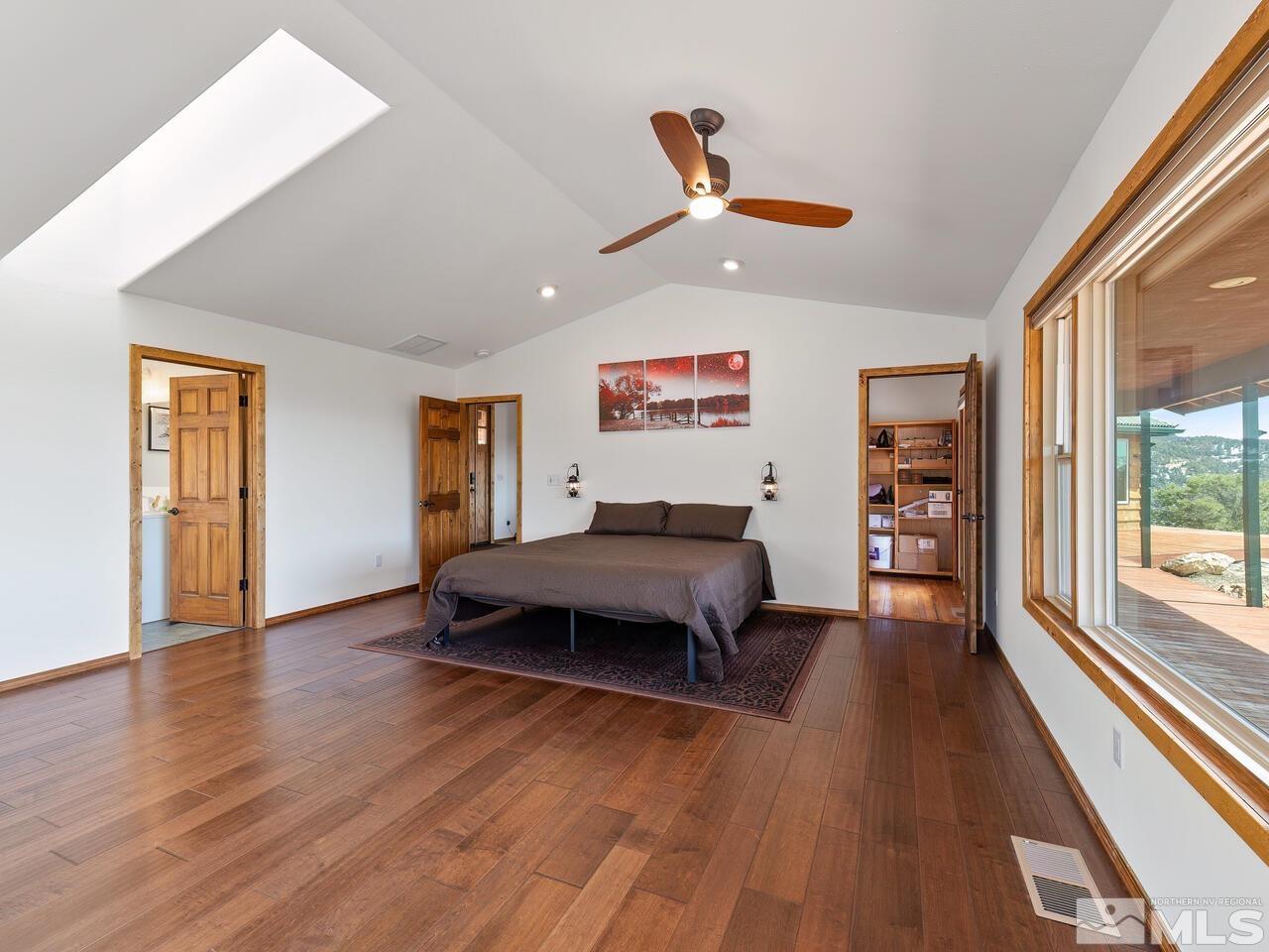 700 Saddleback Road Reno, NV 89521 - Photo 21 of 38 a spacious bedroom with a bed and a large window