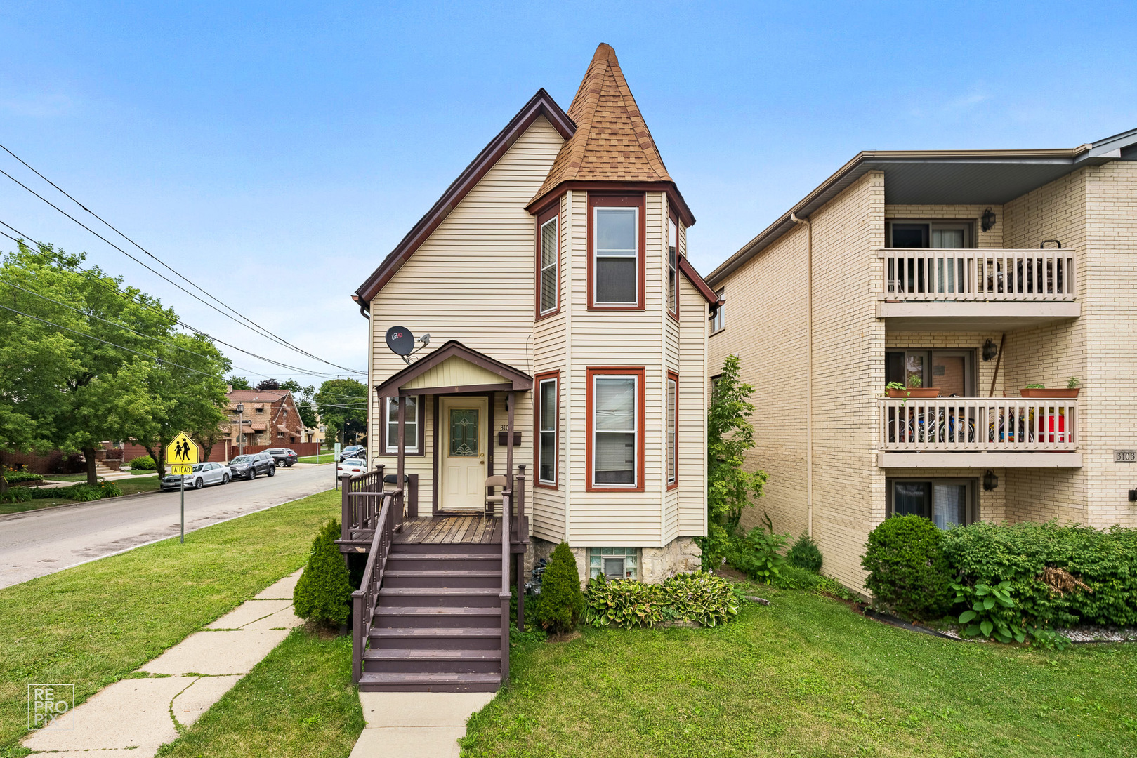 3101 Grove Avenue Berwyn, IL 60402 - Photo 1 of 14 a front view of a house with a yard