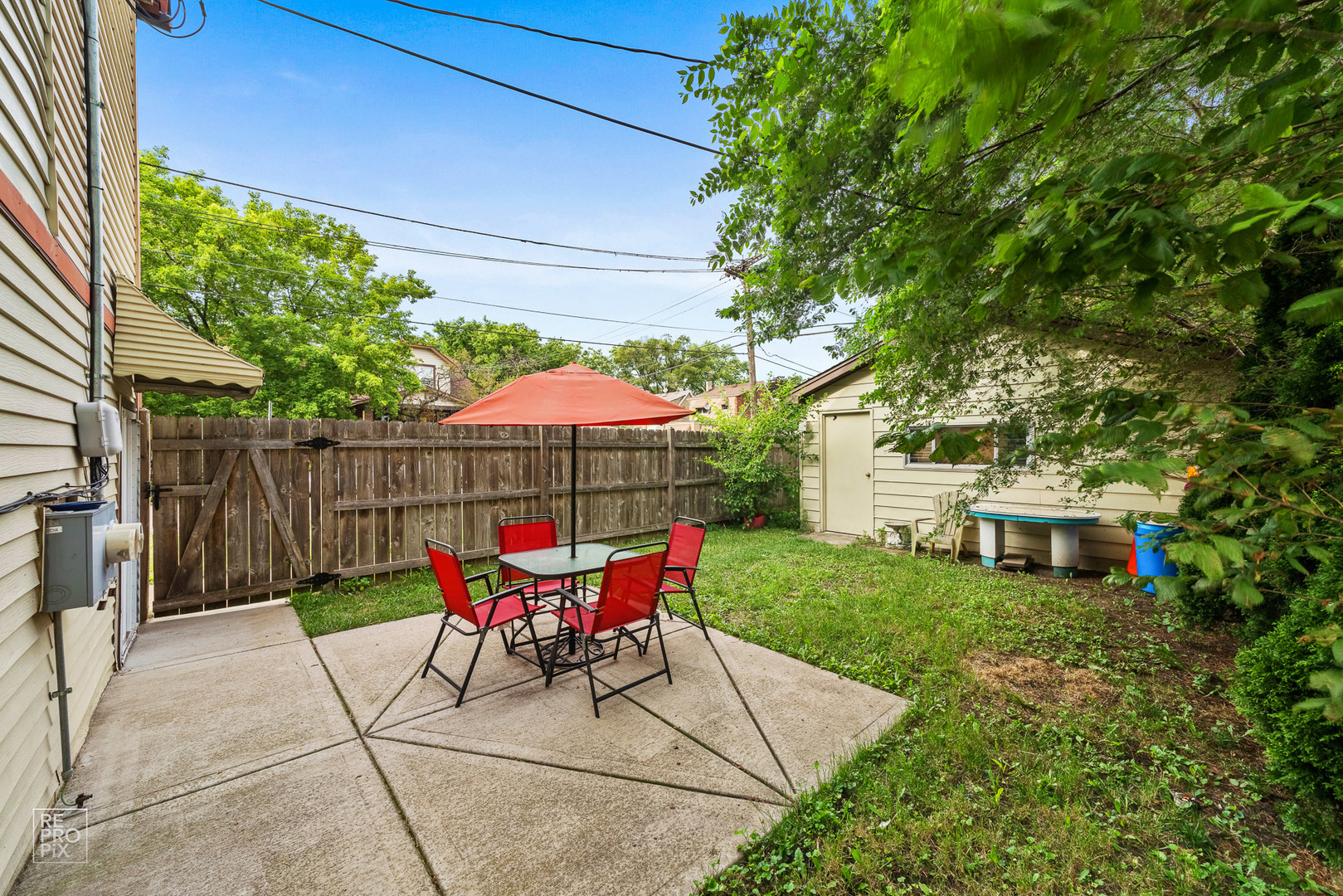 3101 Grove Avenue Berwyn, IL 60402 - Photo 13 of 14 a patio with a patio table and chairs