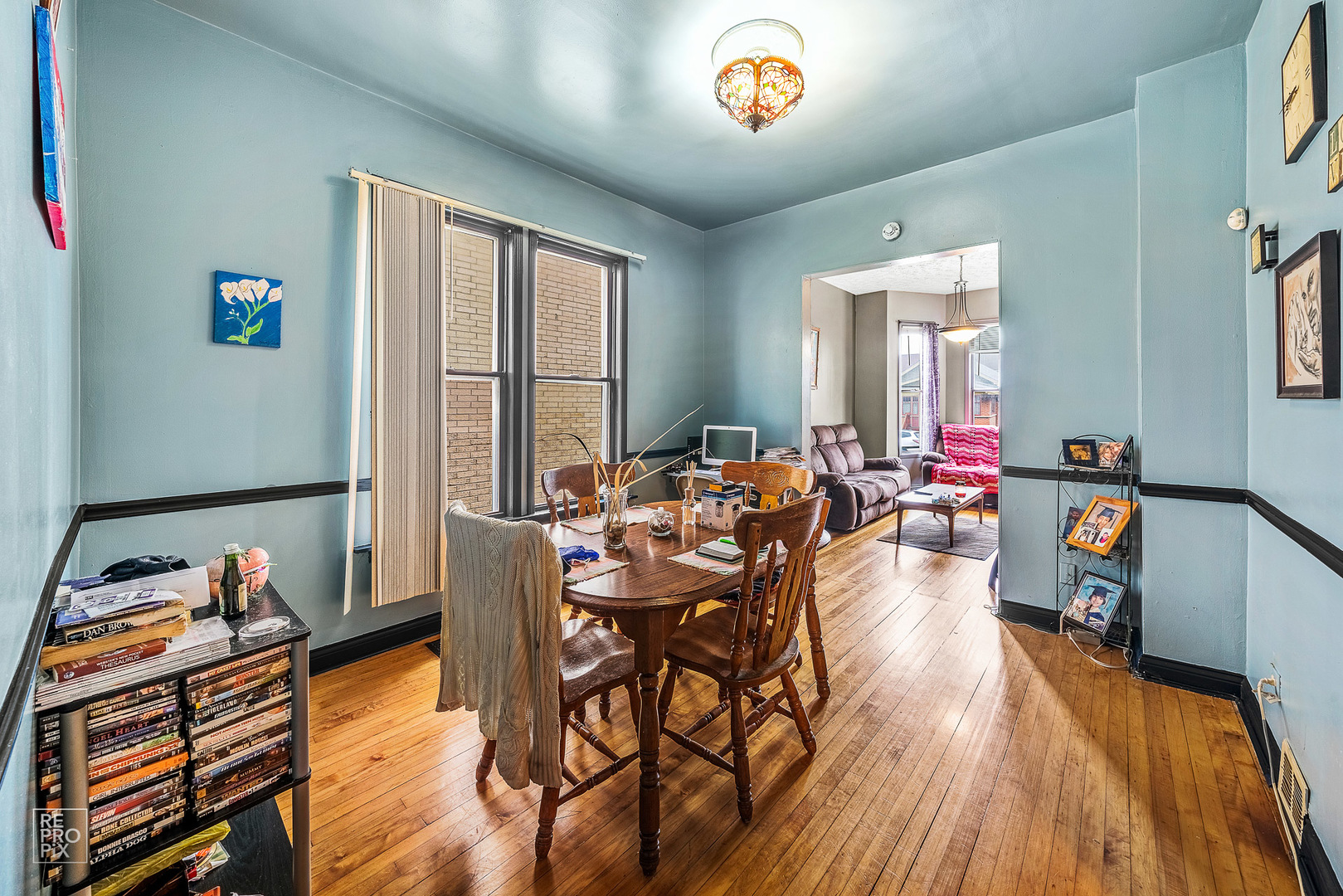 3101 Grove Avenue Berwyn, IL 60402 - Photo 3 of 14 a view of a dining room with furniture window and wooden floor