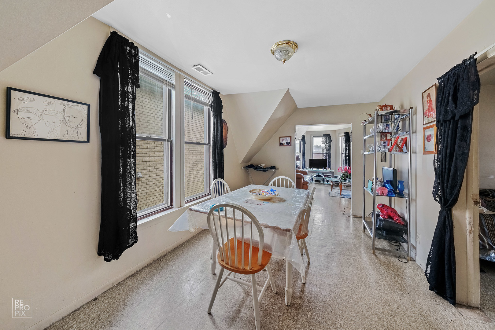 3101 Grove Avenue Berwyn, IL 60402 - Photo 5 of 14 a living room with furniture a air conditioner and a window