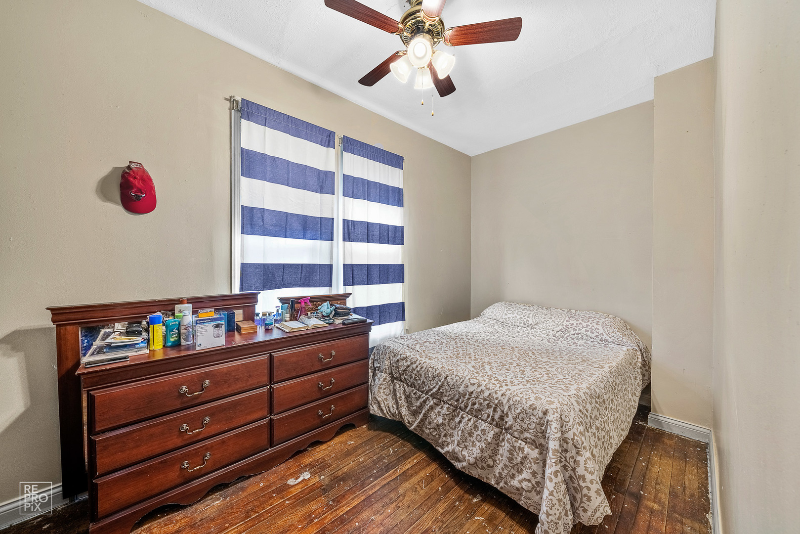 3101 Grove Avenue Berwyn, IL 60402 - Photo 7 of 14 a bedroom with a bed and a dresser