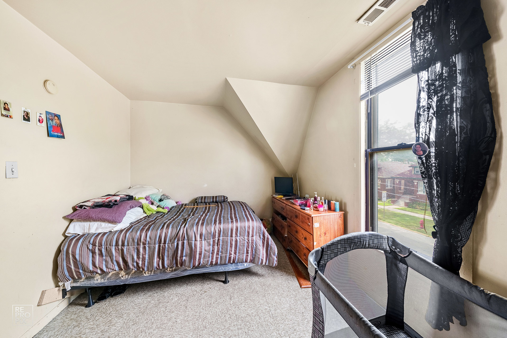 3101 Grove Avenue Berwyn, IL 60402 - Photo 8 of 14 a bedroom with a bed and a window