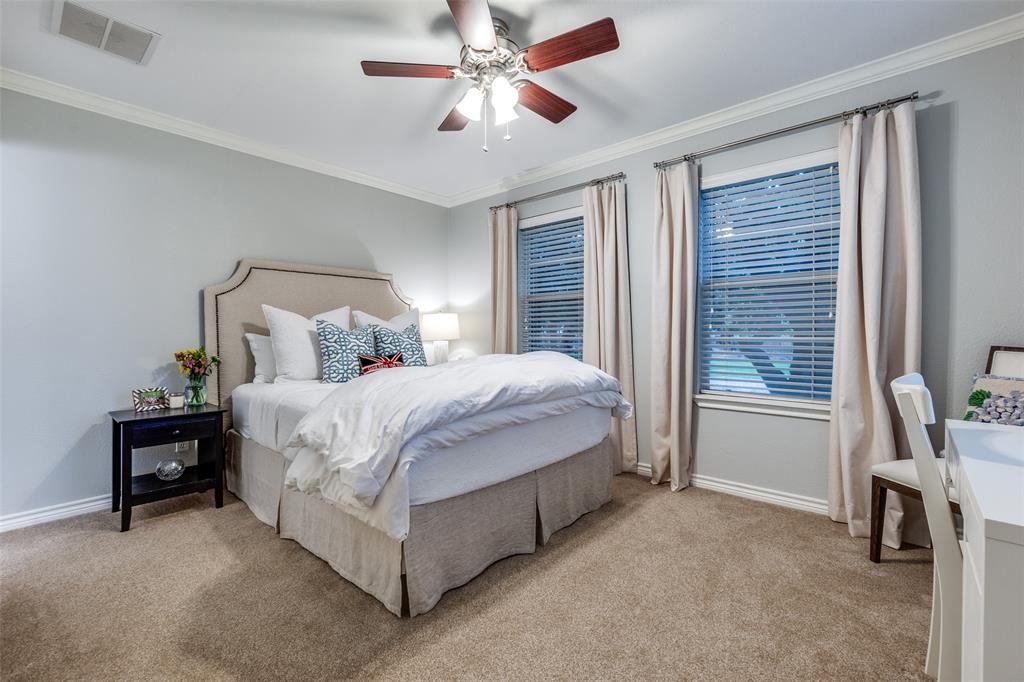 4159 Clover Lane Dallas, TX 75220 - Photo 18 of 25 Bedroom featuring light colored carpet, baseboards, ornamental molding, and a ceiling fan