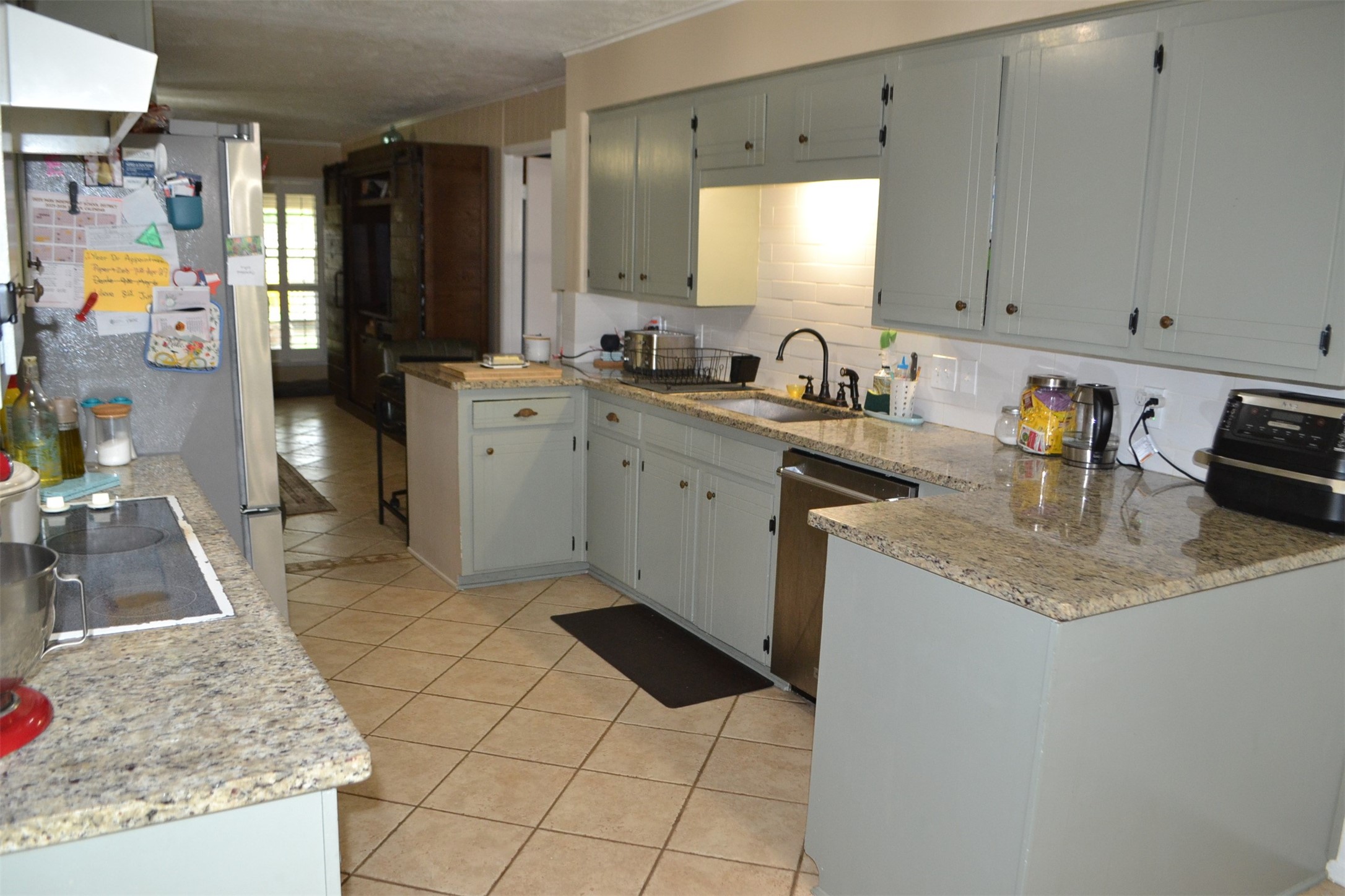 610 East X Street Deer Park, TX 77536 - Photo 9 of 44 a kitchen with a sink and cabinets