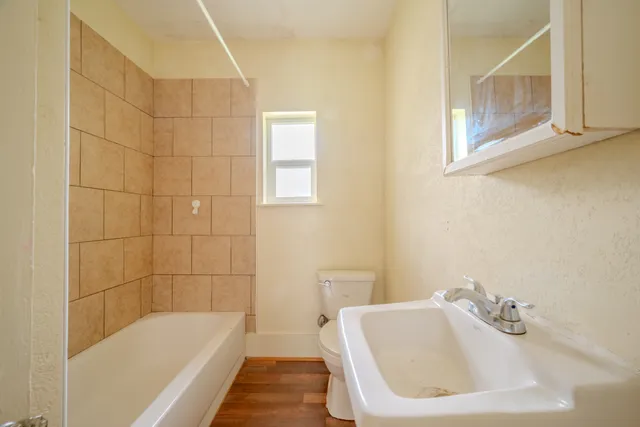 a bathroom with a sink a bathtub and a shower