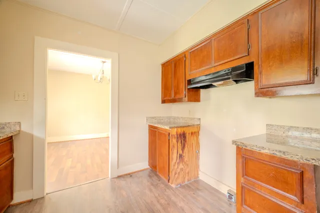 a view of a storage & utility room with wooden floor
