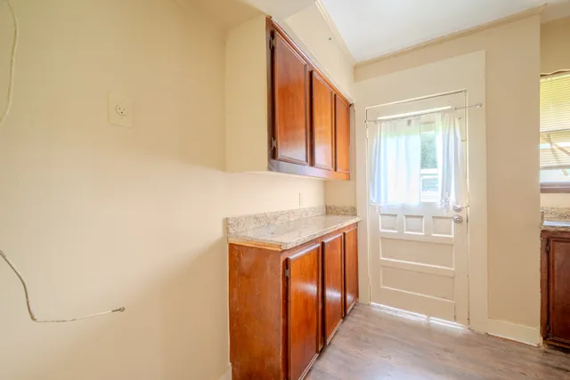 a hallway with washer and dryer