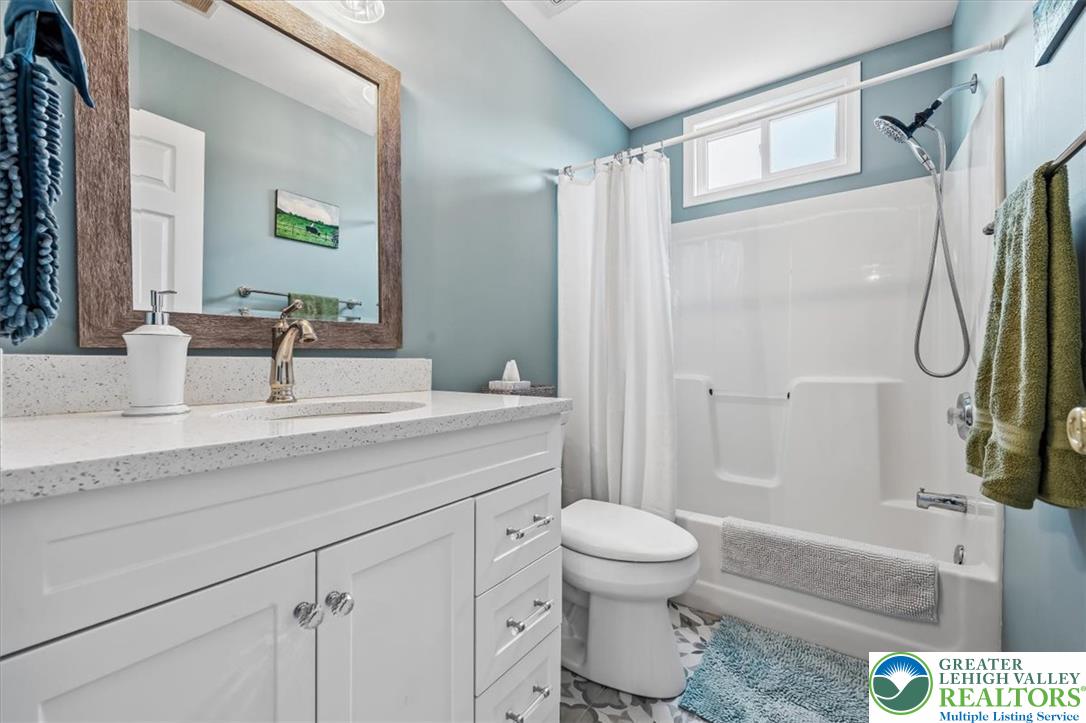 2011 Fieldview Drive Nazareth, PA 18064 - Photo 28 of 52 A well-appointed bathroom with a spacious vanity, sleek countertops, and a full shower-tub combination.