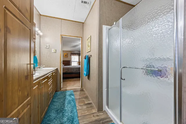 a bathroom with a double vanity sink and a mirror
