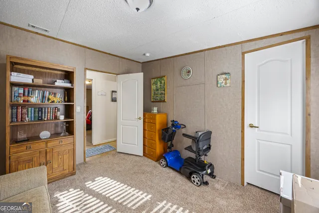 a view of a livingroom with workspace and a couch
