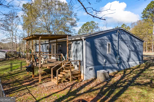 a view of a chairs and table in the patio