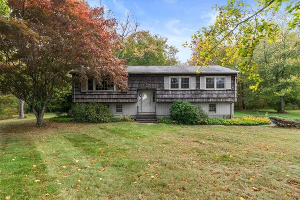 a view of a house with a yard