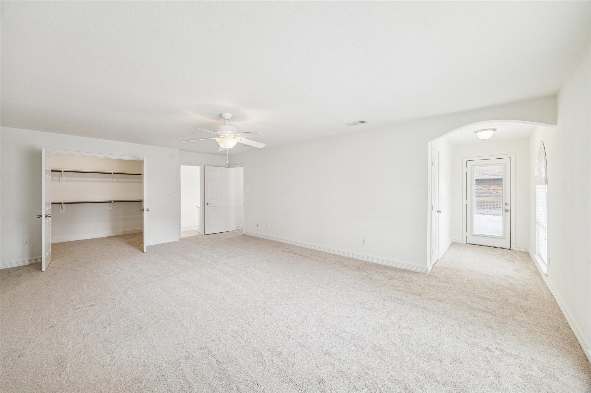 4314 Oxhill Road Spring, TX 77388 - Photo 10 of 22 Large primary suite with plush neutral carpeting access up upstairs covered balcony.