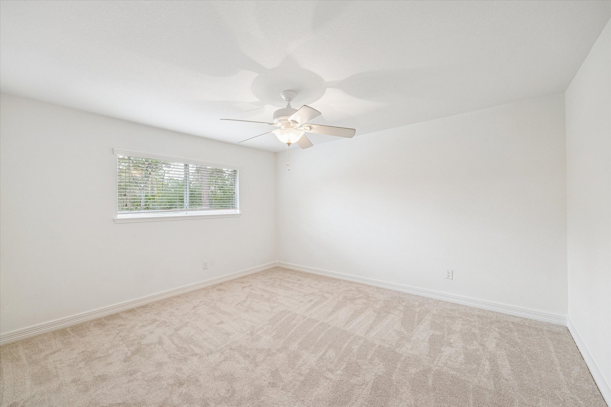 4314 Oxhill Road Spring, TX 77388 - Photo 16 of 22 One of four secondary bedrooms with plush neutral carpeting.
