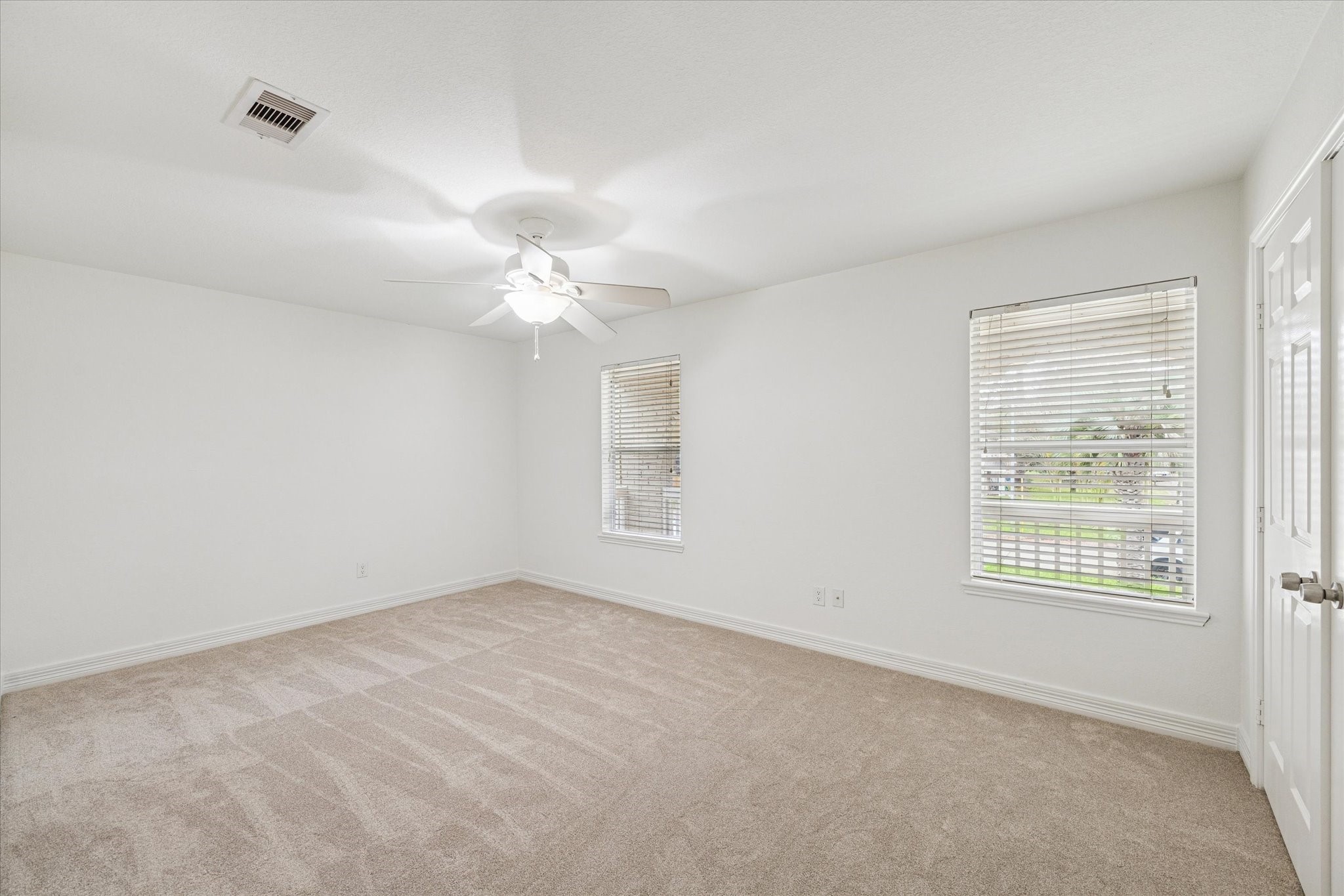 4314 Oxhill Road Spring, TX 77388 - Photo 17 of 22 Two of four secondary bedrooms with plush neutral carpeting.