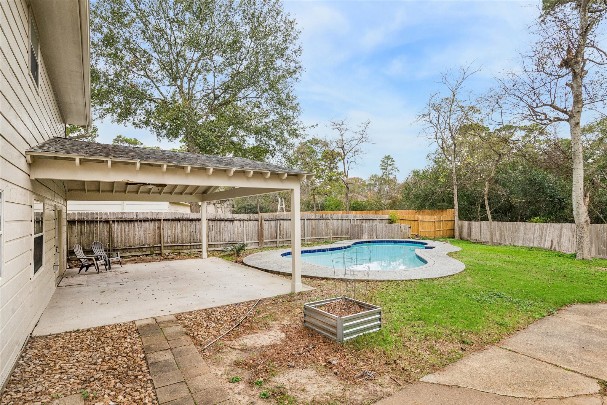 4314 Oxhill Road Spring, TX 77388 - Photo 19 of 22 Large covered patio overlooking the pool make things perfect for entertaining!
