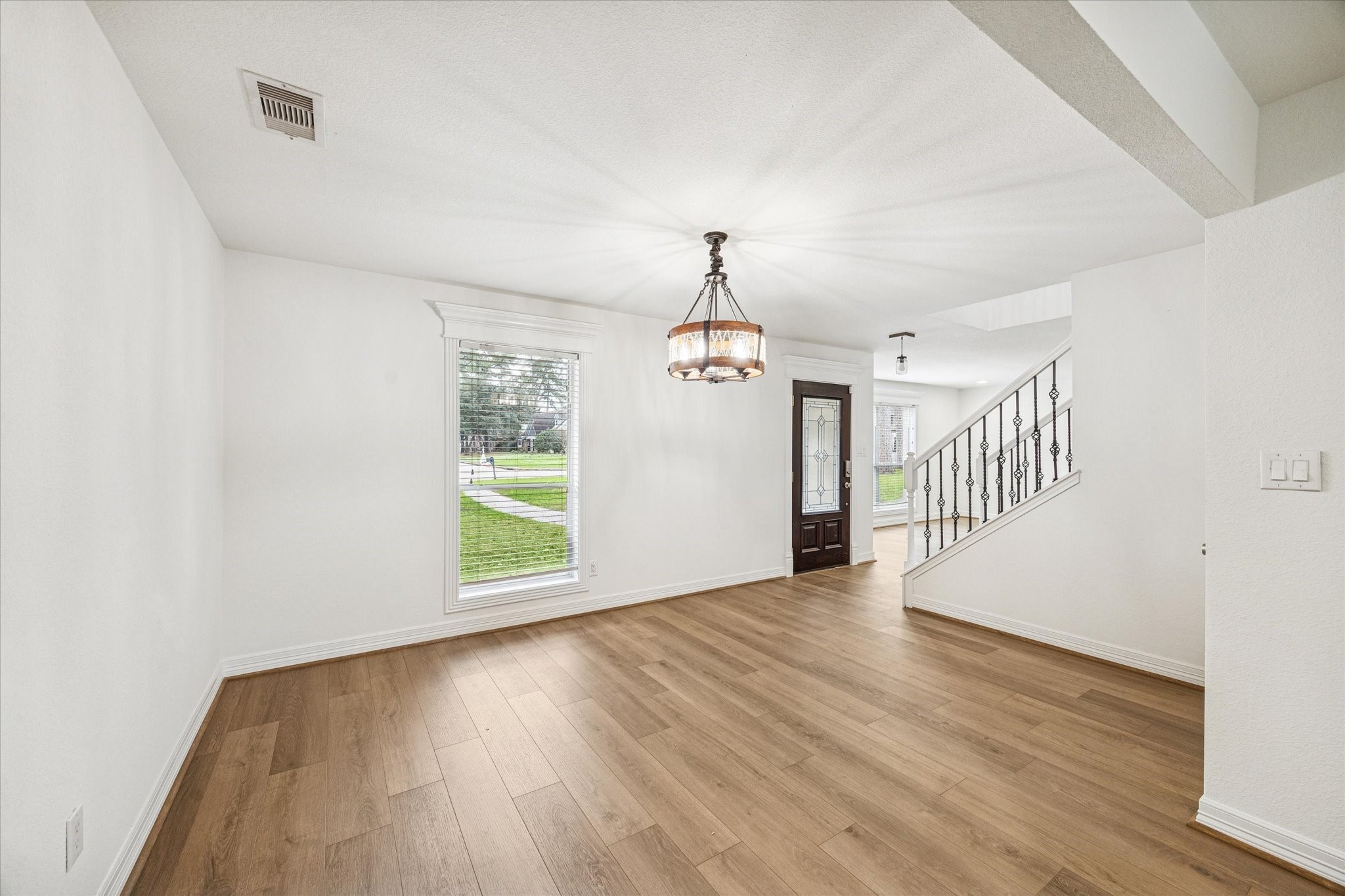 4314 Oxhill Road Spring, TX 77388 - Photo 1 of 22 View of dining room looking to front of house with beautiful engineered wood floors.