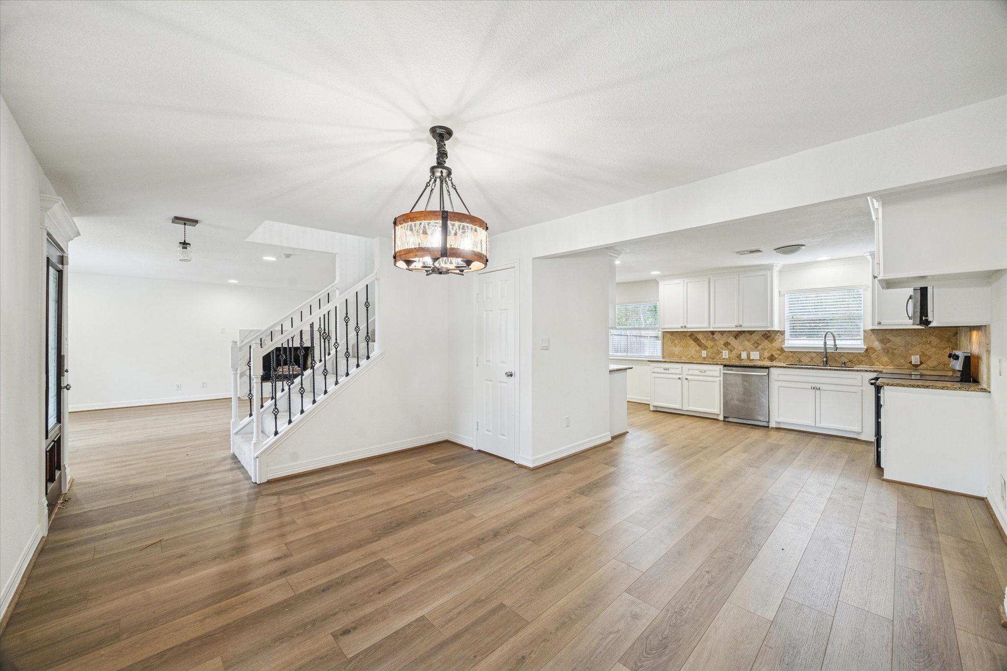 4314 Oxhill Road Spring, TX 77388 - Photo 2 of 22 Another view of dining room looking into kitchen and across entry.