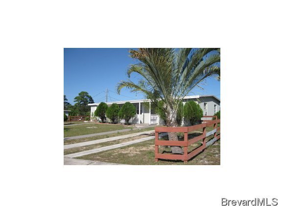 1119 Northeast Jordan Palm Bay, FL 32905 - Photo 1 of 12 a outdoor living space with furniture