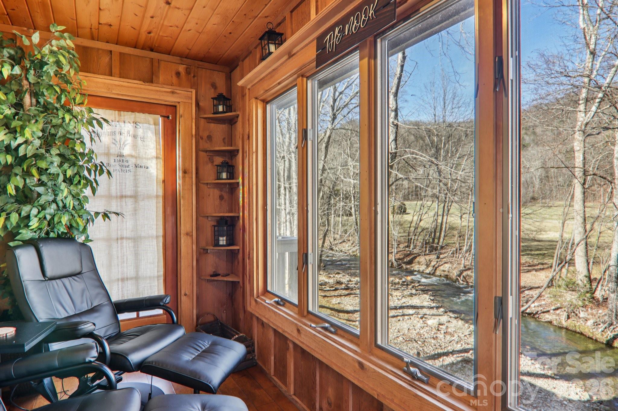 129 Riverside Villa Drive Maggie Valley, NC 28751 - Photo 19 of 43 a living room with furniture and a window