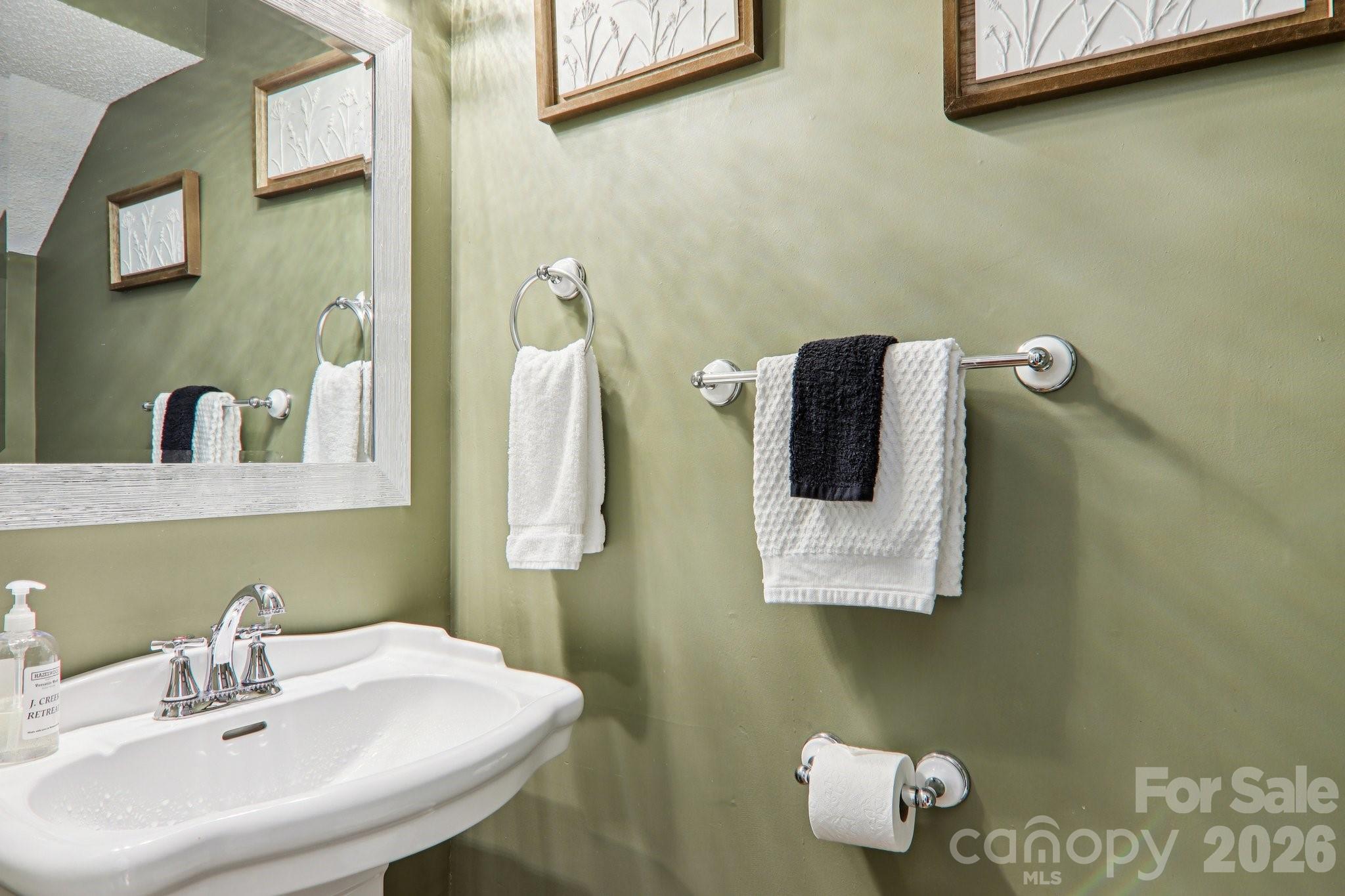 129 Riverside Villa Drive Maggie Valley, NC 28751 - Photo 33 of 43 a bathroom with a sink and a mirror
