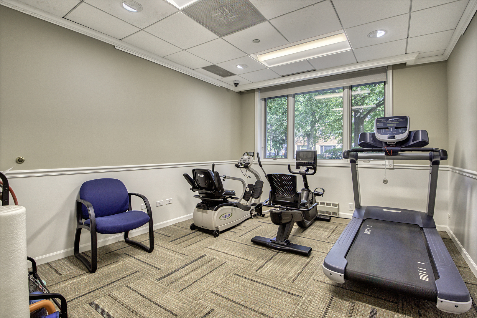 1020 Grove Street, Unit 301 Evanston, IL 60201 - Photo 19 of 23 a room with gym equipment and a large window