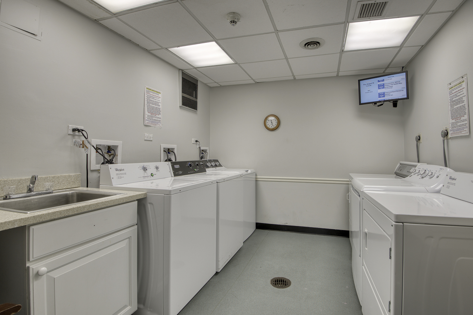 1020 Grove Street, Unit 301 Evanston, IL 60201 - Photo 20 of 23 a utility room with cabinets washer and dryer