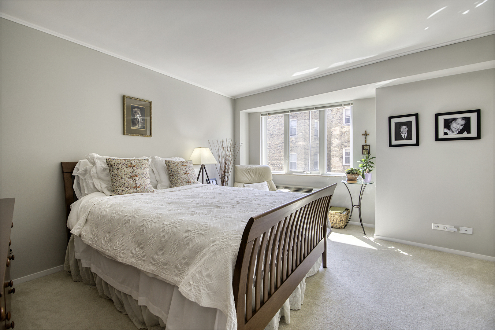 1020 Grove Street, Unit 301 Evanston, IL 60201 - Photo 10 of 23 a bedroom with a bed and a large window