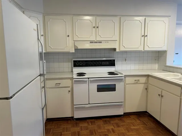 a view of an entryway with wooden floor and a window