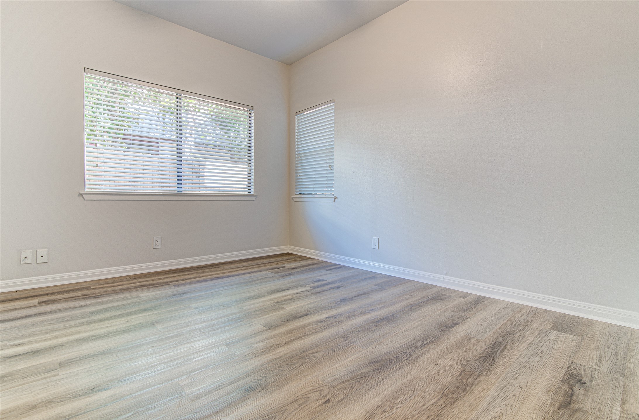 311 West Mary Street Austin, TX 78704 - Photo 28 of 35 Natural light filters into this room, featuring sleek flooring and clean wall lines.