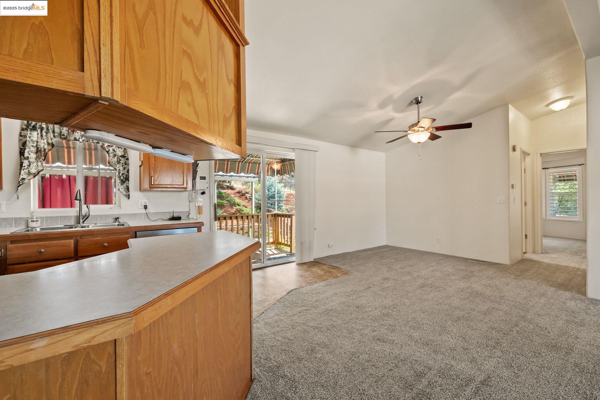 23732 Parrotts Ferry Road, Unit SPC 47 Columbia, CA 95310 - Photo 12 of 31 a kitchen with stainless steel appliances a sink and cabinets