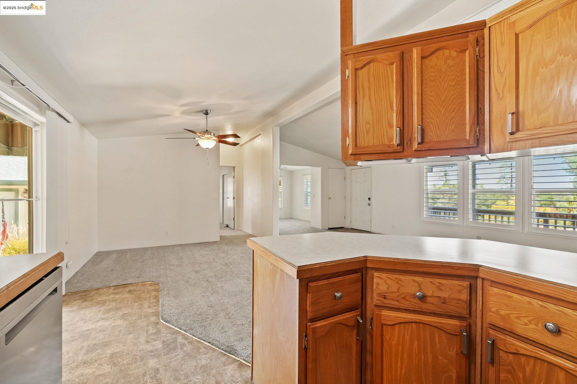 23732 Parrotts Ferry Road, Unit SPC 47 Columbia, CA 95310 - Photo 18 of 31 a kitchen with granite countertop cabinets and window
