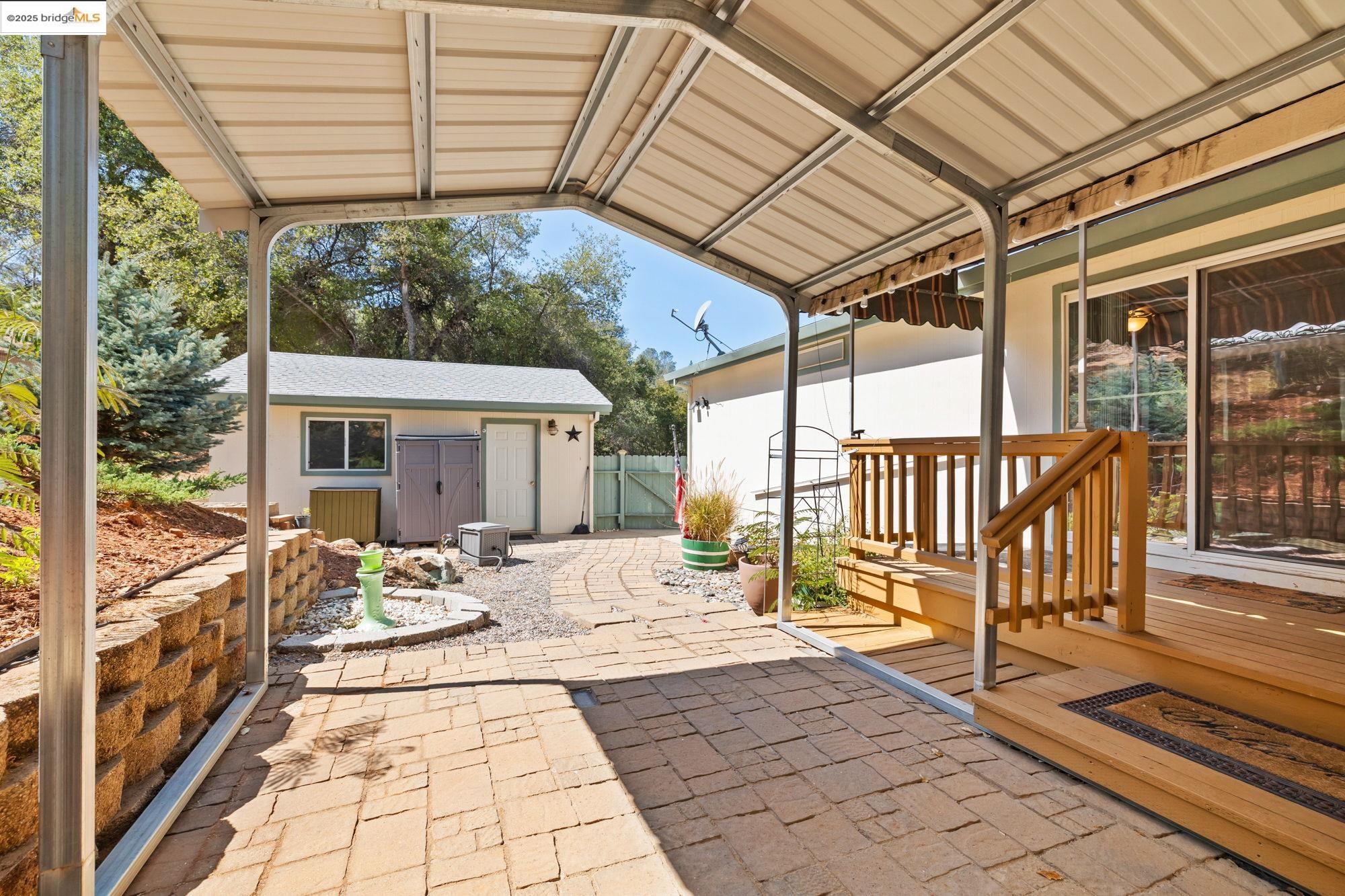 23732 Parrotts Ferry Road, Unit SPC 47 Columbia, CA 95310 - Photo 27 of 31 a view of a patio with wooden floor