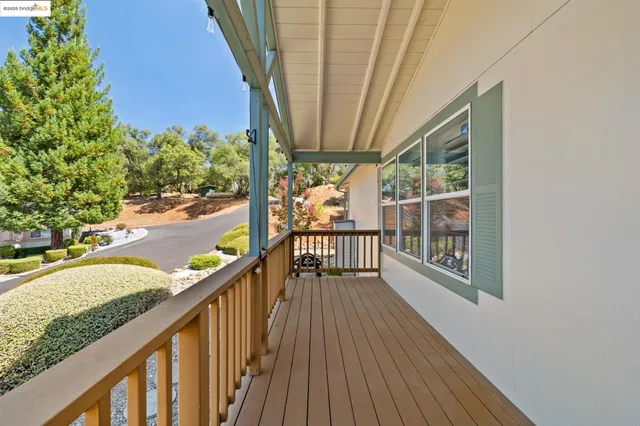 a view of balcony with wooden floor
